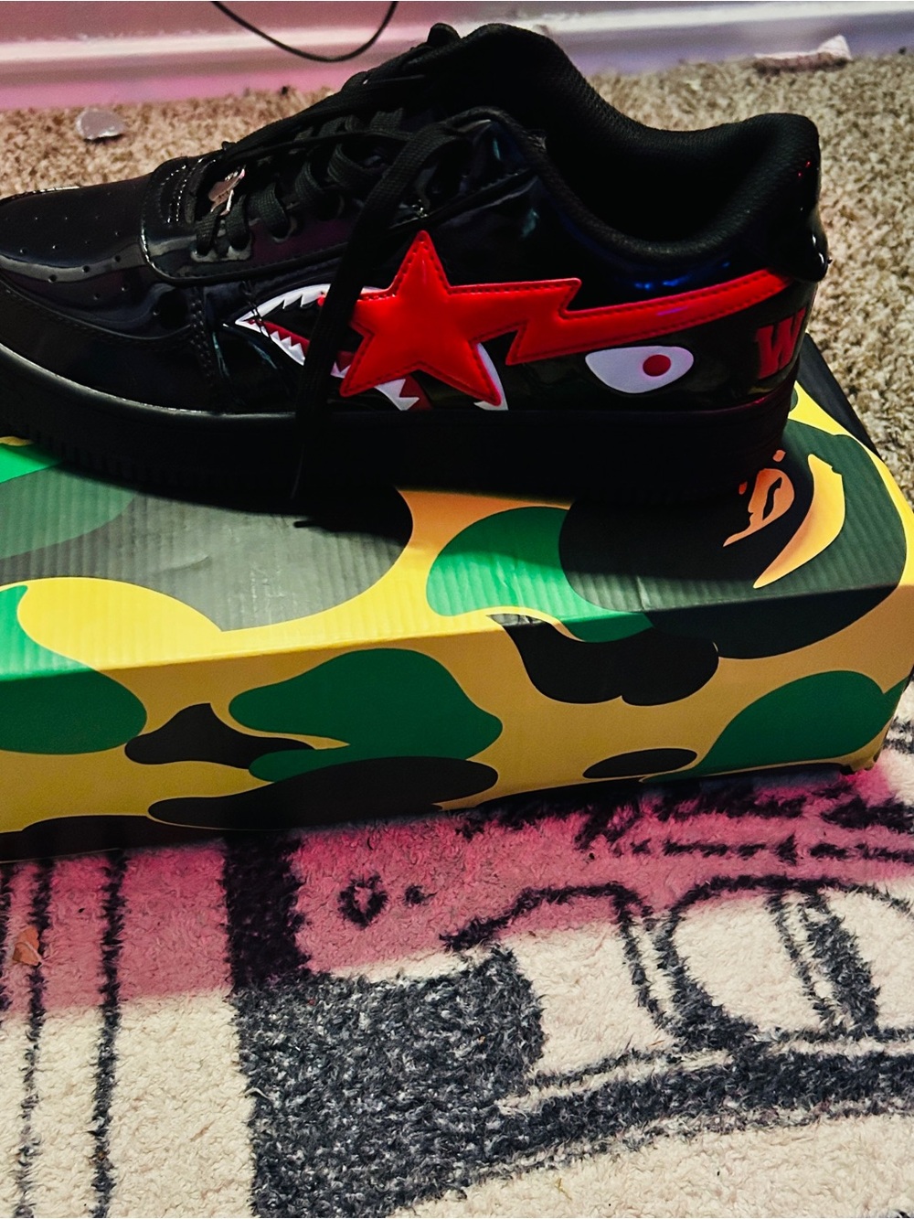 Bape Kids Black Sneaker with Red Star and White Eye Detail